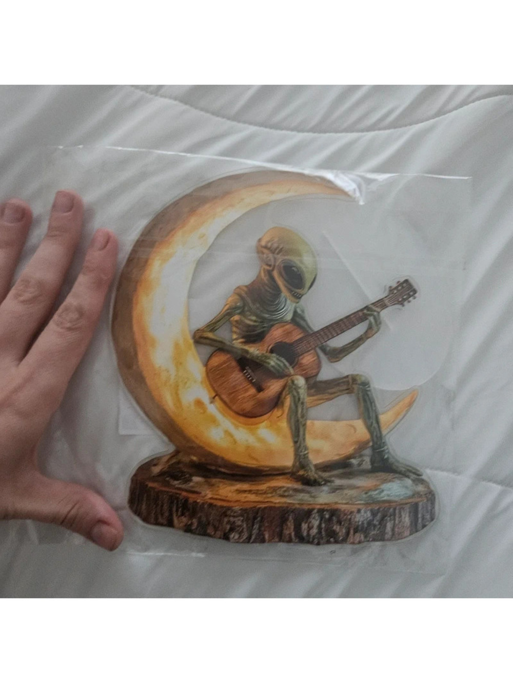 Alien Figurine Sitting on Crescent Moon Playing Guitar Sculpture